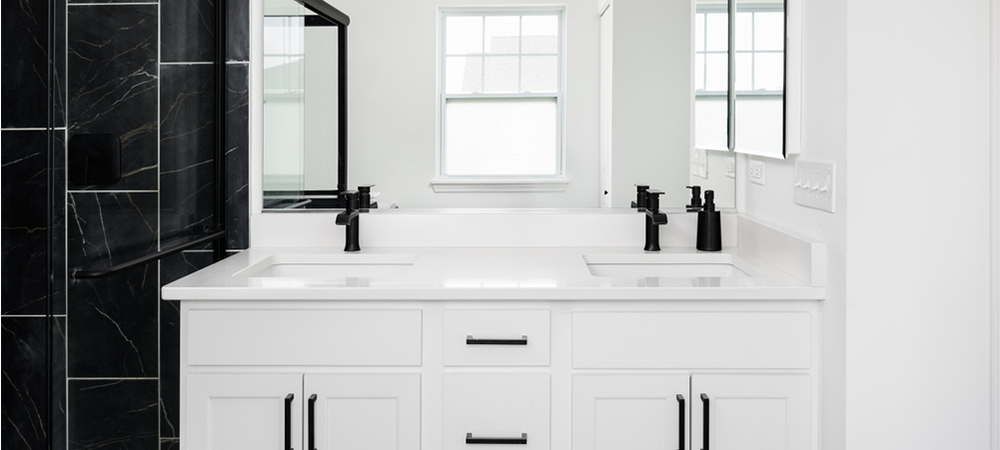 Double sink vanity with black hardware Double sink vanity with black hardware