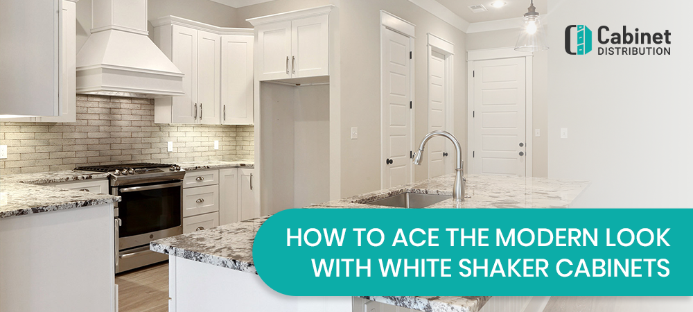 Modern white shaker kitchen with marble countertops and stainless steel appliances by Cabinet Distribution