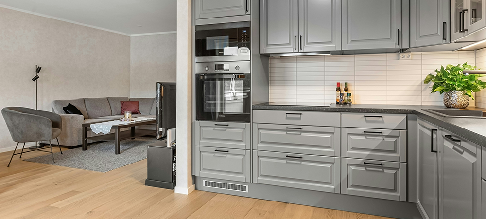 Dove gray cabinetry with open living space Dove gray cabinetry with open living space