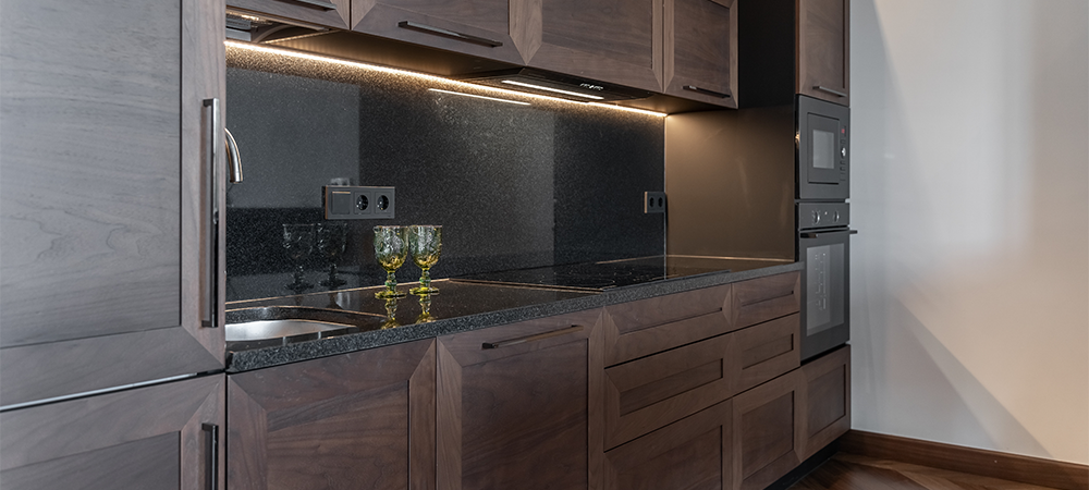 Driftwood cabinets with black granite backsplash Driftwood cabinets with black granite backsplash